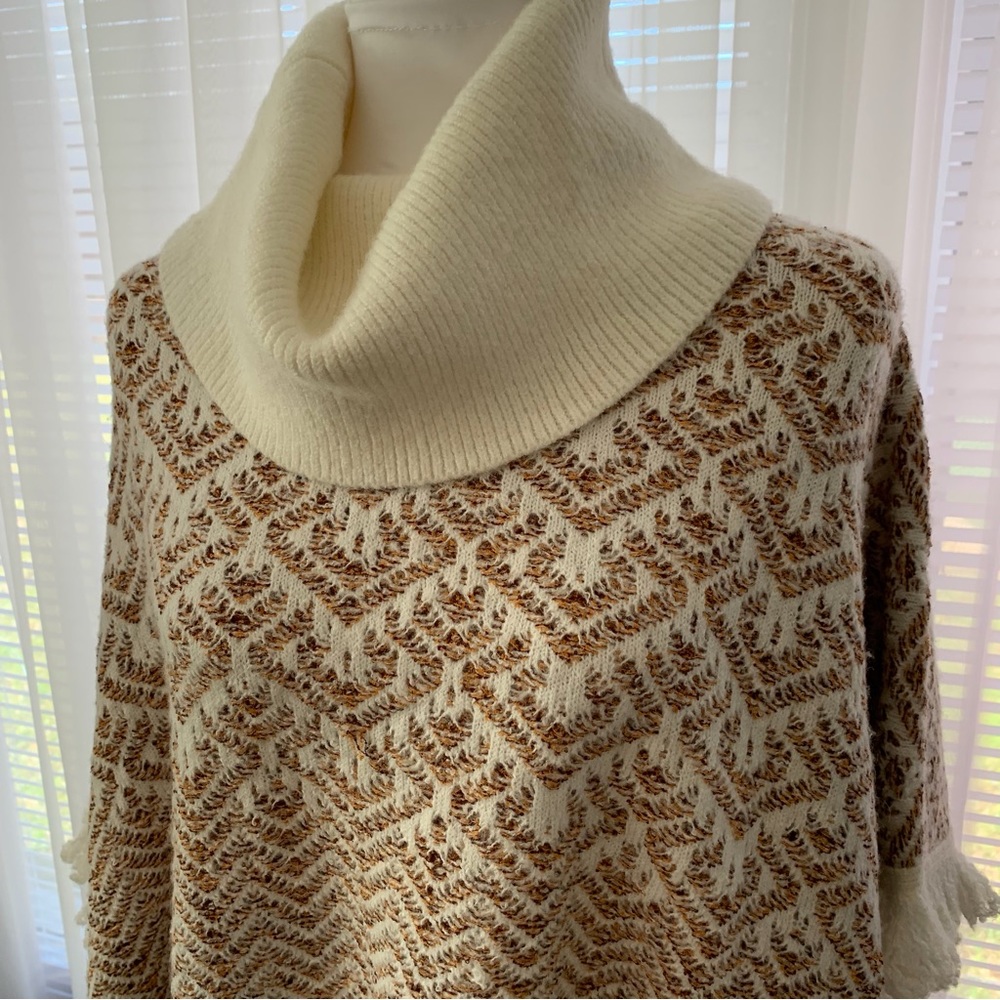 Super soft and comfortable turtle neck sweater poncho.